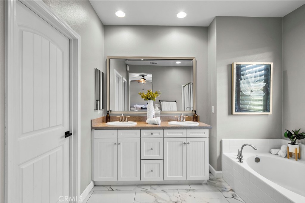 22157 Barrington Way Saugus, CA 91350 - Photo 29 of 46 a bathroom with a granite countertop sink double vanity