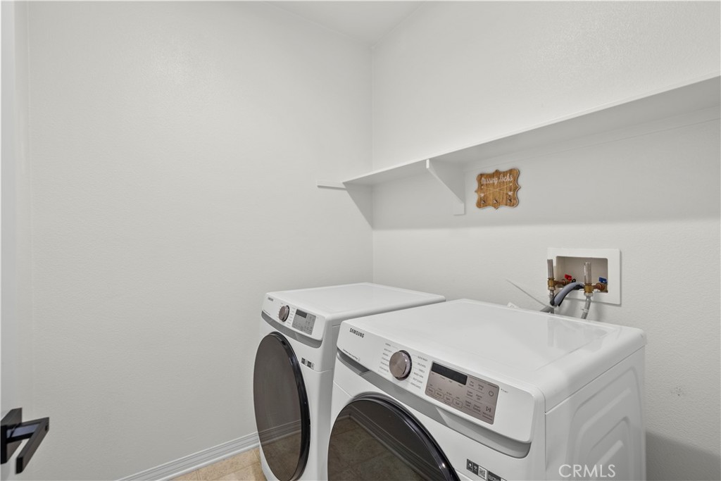 22157 Barrington Way Saugus, CA 91350 - Photo 30 of 46 a utility room with dryer and washer