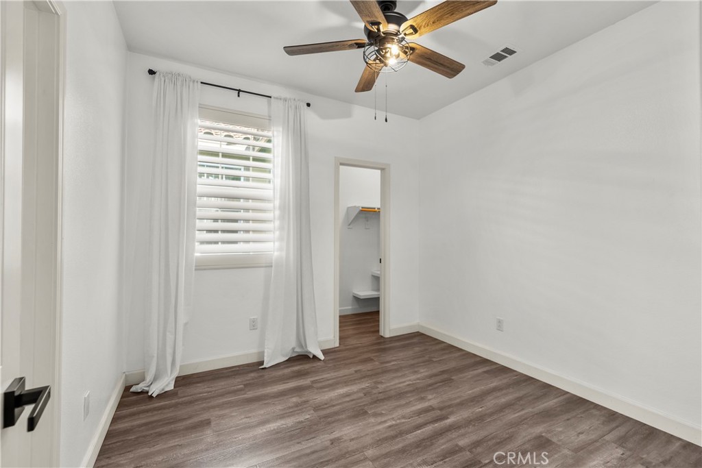 22157 Barrington Way Saugus, CA 91350 - Photo 31 of 46 an empty room with wooden floor closet and windows
