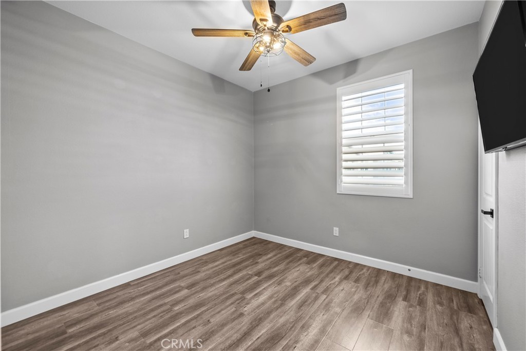 22157 Barrington Way Saugus, CA 91350 - Photo 34 of 46 wooden floor in an empty room with a window