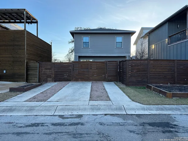 a front view of a house with garage