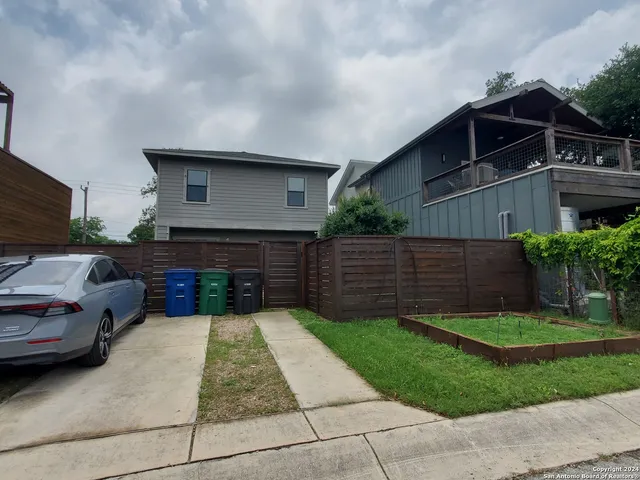 a view of house with yard outdoor seating and entertaining space