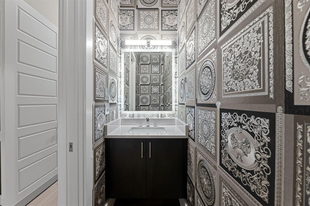 7854 Element Avenue Plano, TX 75024 - Photo 5 of 38 Half bathroom featuring vanity and Versace Wallpaper