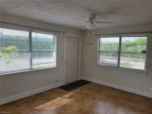 a bathroom with a toilet and a bathtub