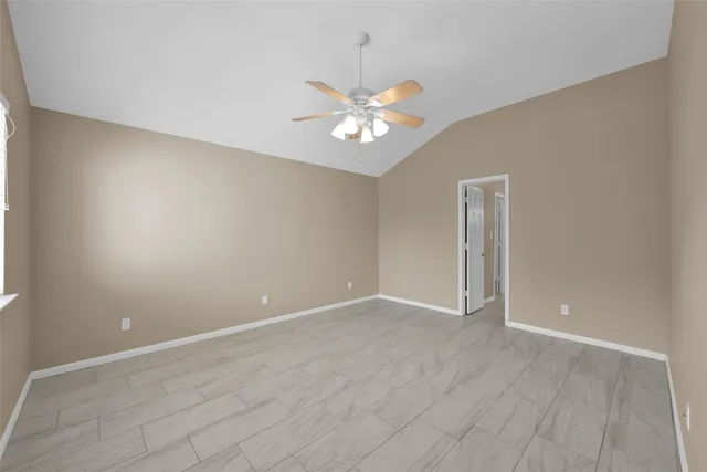 a bathroom with a tub a double vanity sink and a mirror