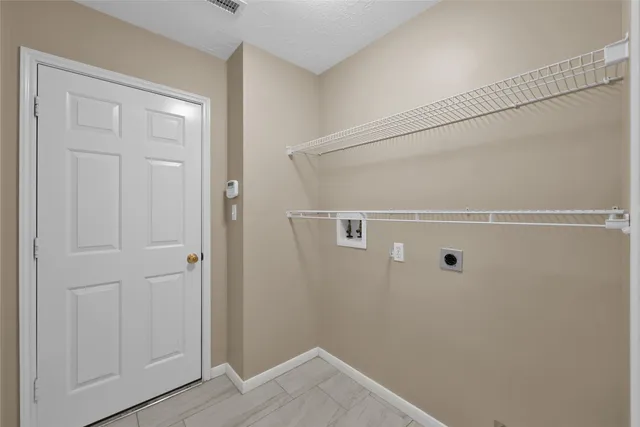 a view of a house with a yard and deck