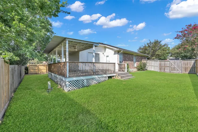 a view of a porch with wooden floor