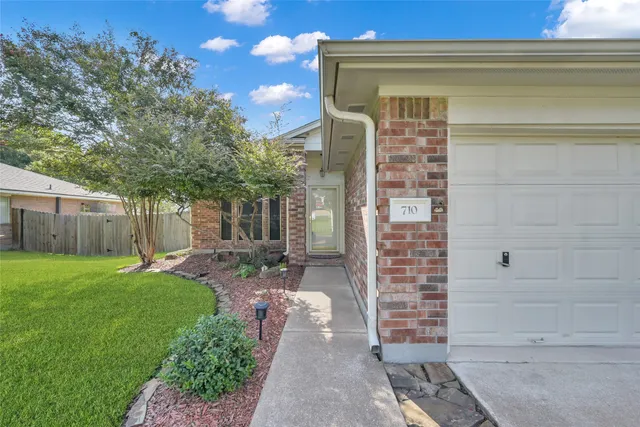 a view of a back yard of the house