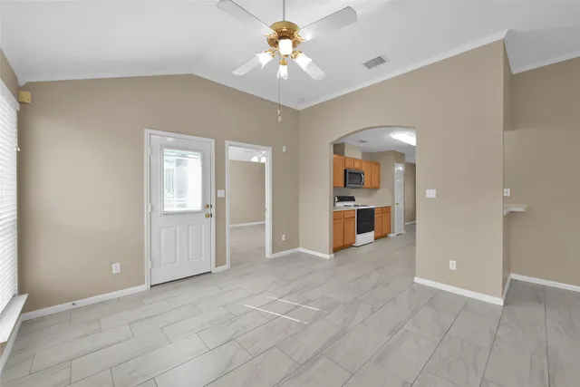 a view of an empty room with a window