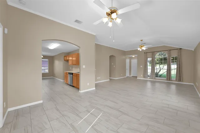 a kitchen with a sink cabinets and window