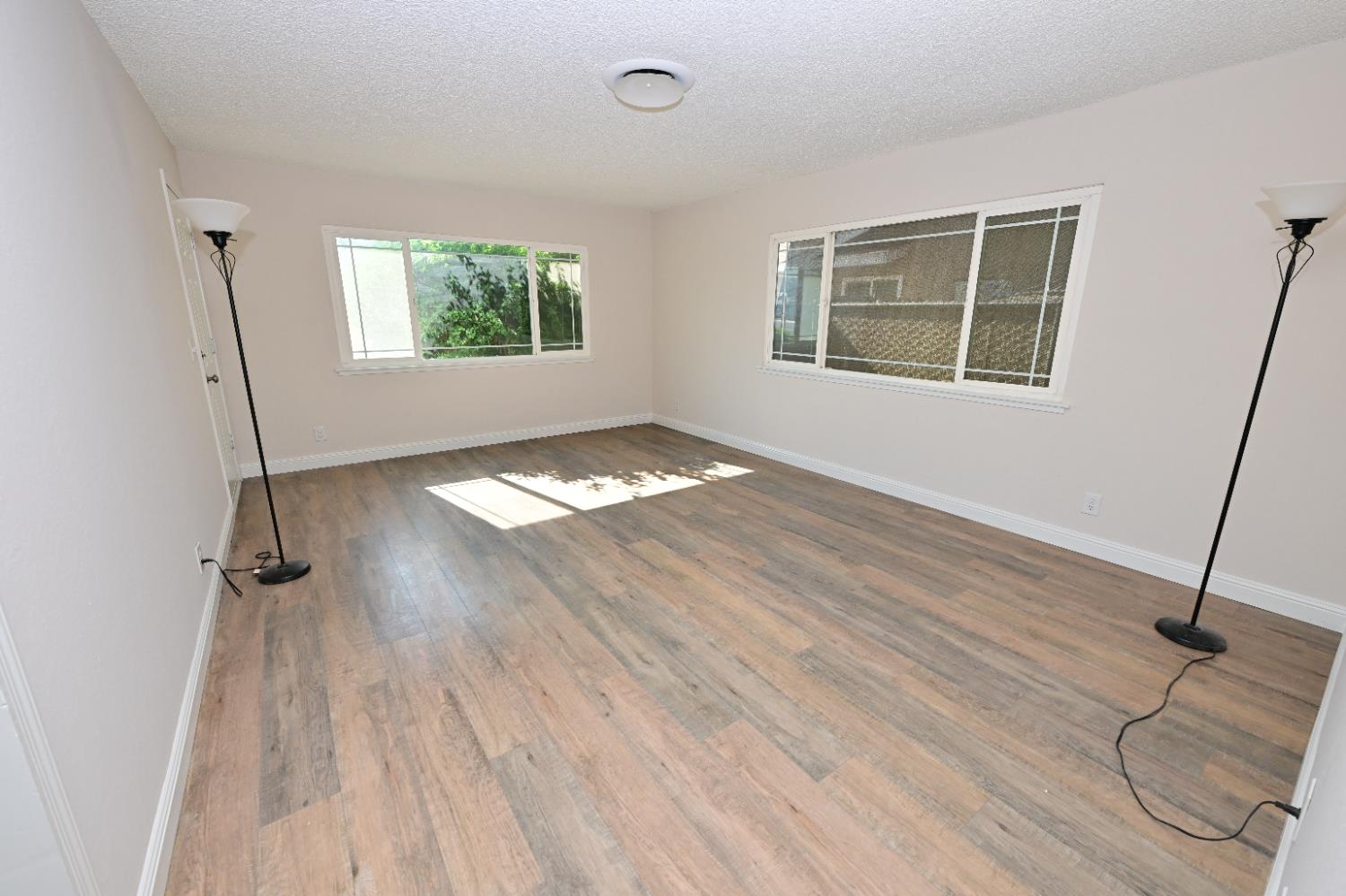 133 10th Street Clovis, CA 93612 - Photo 2 of 17 a view of an empty room with a window