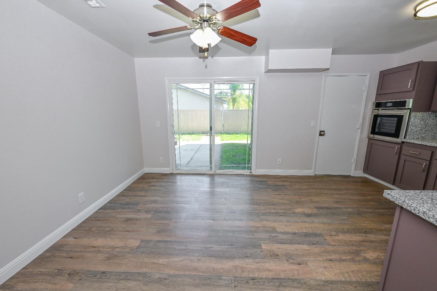 133 10th Street Clovis, CA 93612 - Photo 4 of 17 a view of a kitchen with a sink and cabinet