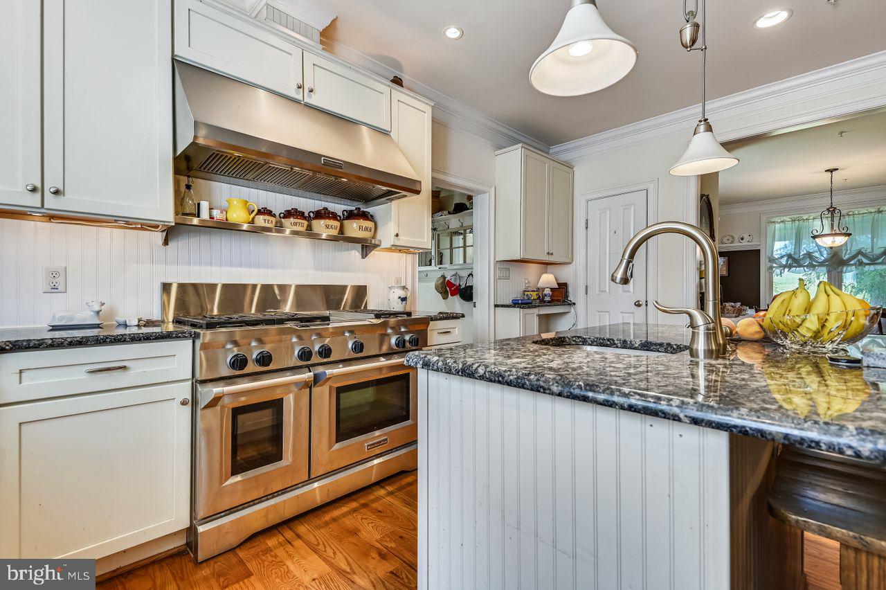 1705 Bachmans Valley Road Westminster, MD 21157 - Photo 12 of 26 Commercial gas range and ovens. Custom cabinetry