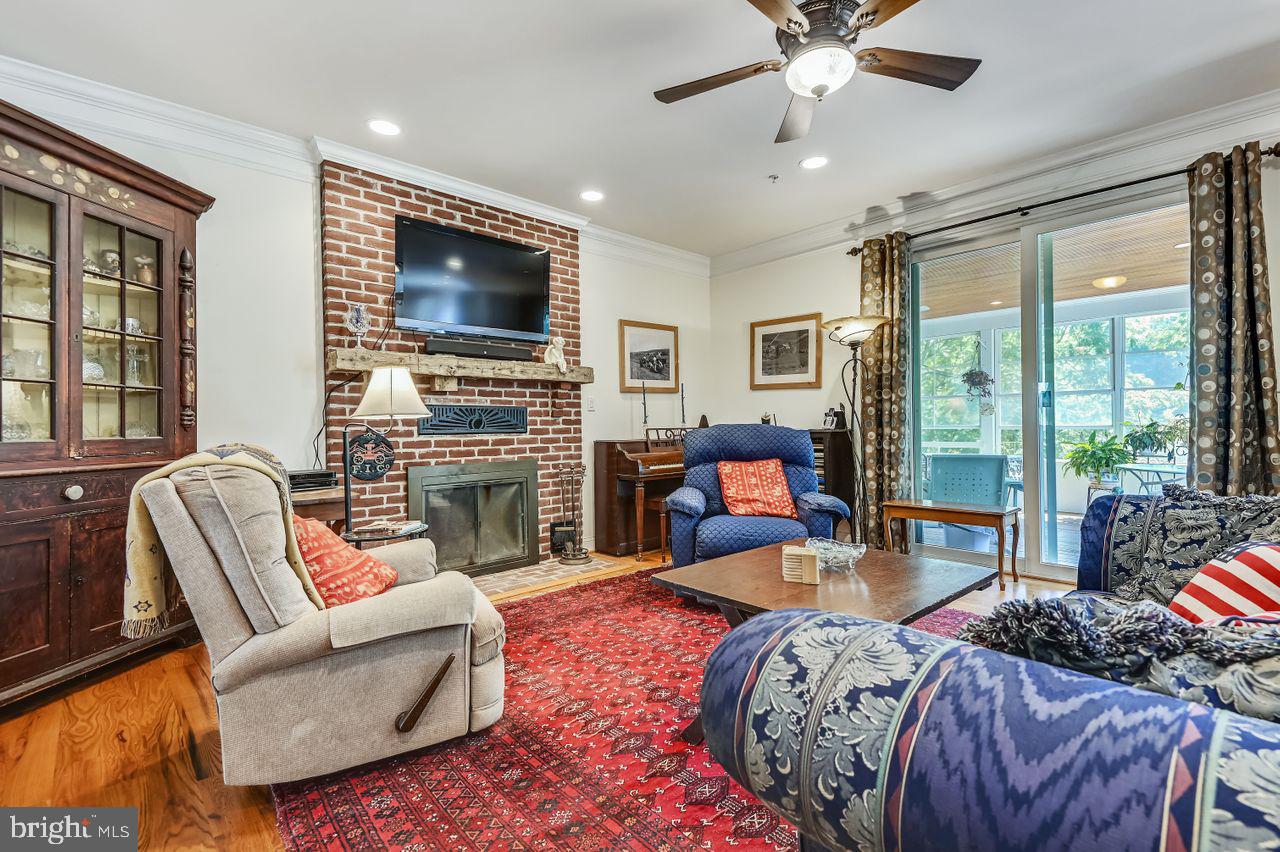 1705 Bachmans Valley Road Westminster, MD 21157 - Photo 14 of 26 Hearth Room with doors to 4 seasons porch.