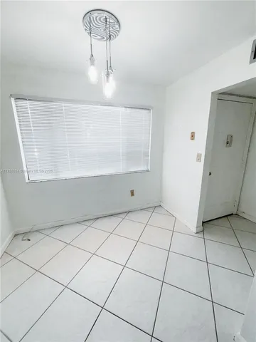 a view of a refrigerator and window