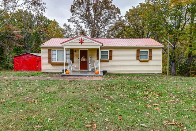 a front view of a house with yard