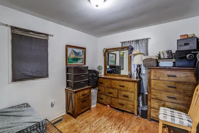 a bed room with a bed and a television