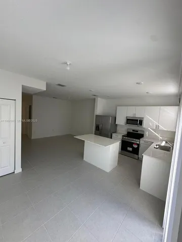 a kitchen with a stove and a microwave