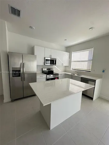a kitchen with a sink and a window