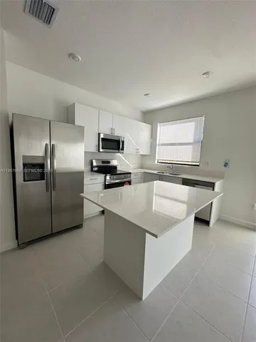 a view of staircase with white walls