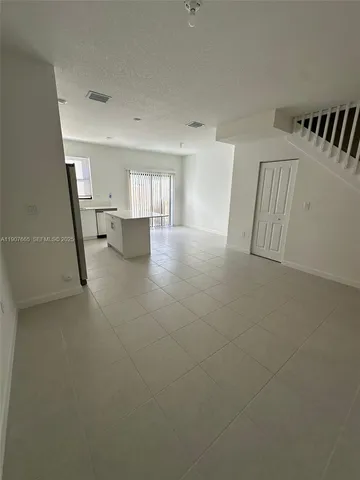 a bathroom with a double vanity sink toilet and shower
