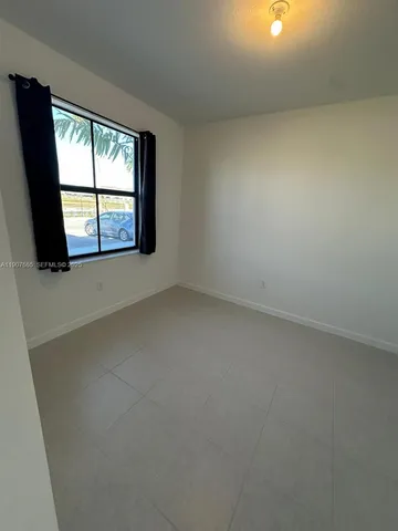 a bathroom with a double vanity sink toilet mirror and shower