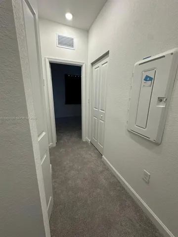 a room with lots of furniture and a table