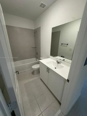 a view of swimming pool with outdoor seating and yard in back