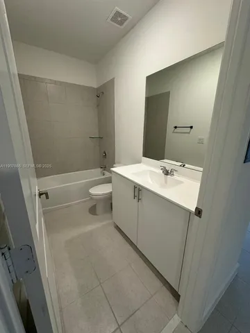 a view of a swimming pool with an outdoor seating