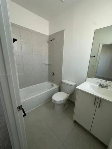 a view of a car park in front of house