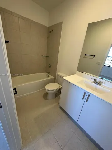 a view of a street with a building in the background