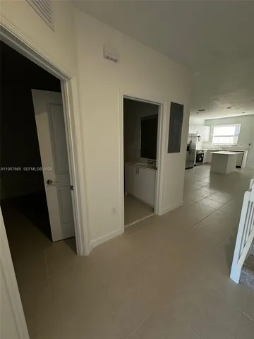 a stove top oven sitting inside of a kitchen