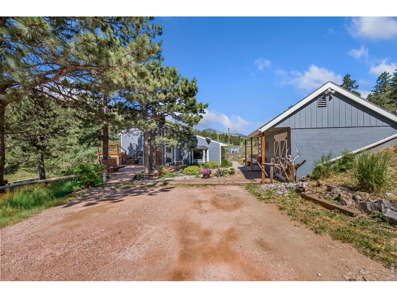 1154 Spring Valley Road Bellvue, CO 80512 - Photo 5 of 31 Gravel driveway, right up to the home and a large storage shed.