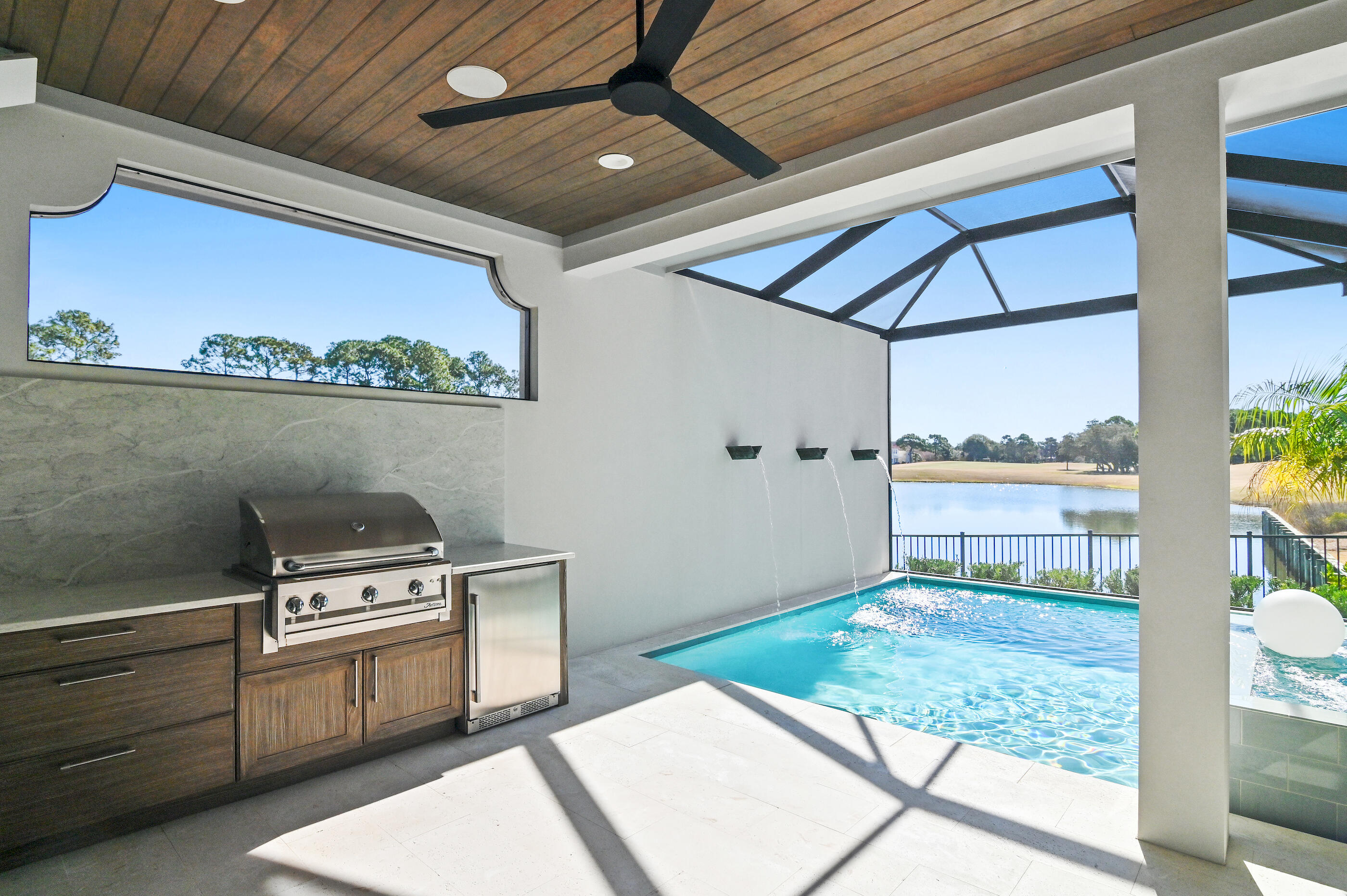 4572 Sailmaker Lane Destin, FL 32541 - Photo 22 of 49 a kitchen with a stove and a microwave