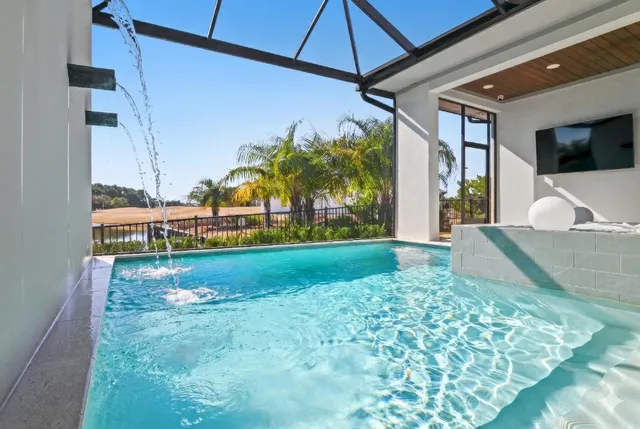 a view of swimming pool with outdoor seating