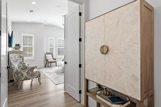 a view of a livingroom with furniture and hardwood floor