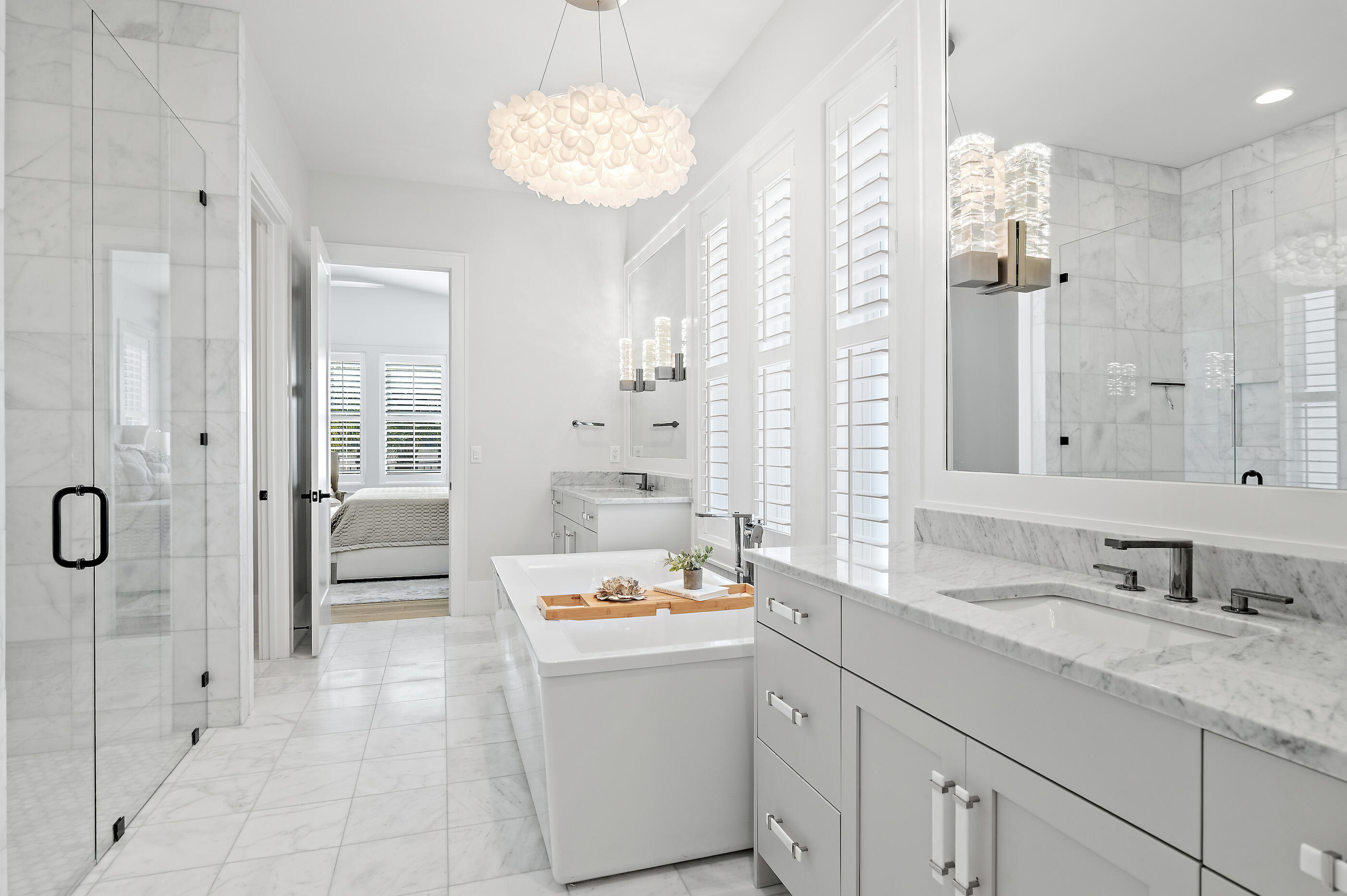 4572 Sailmaker Lane Destin, FL 32541 - Photo 30 of 49 a bathroom with a double vanity sink mirror and shower