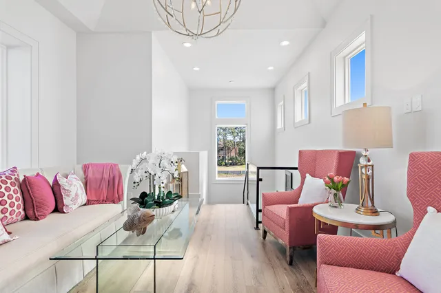 a living room with furniture or couch and a potted plant