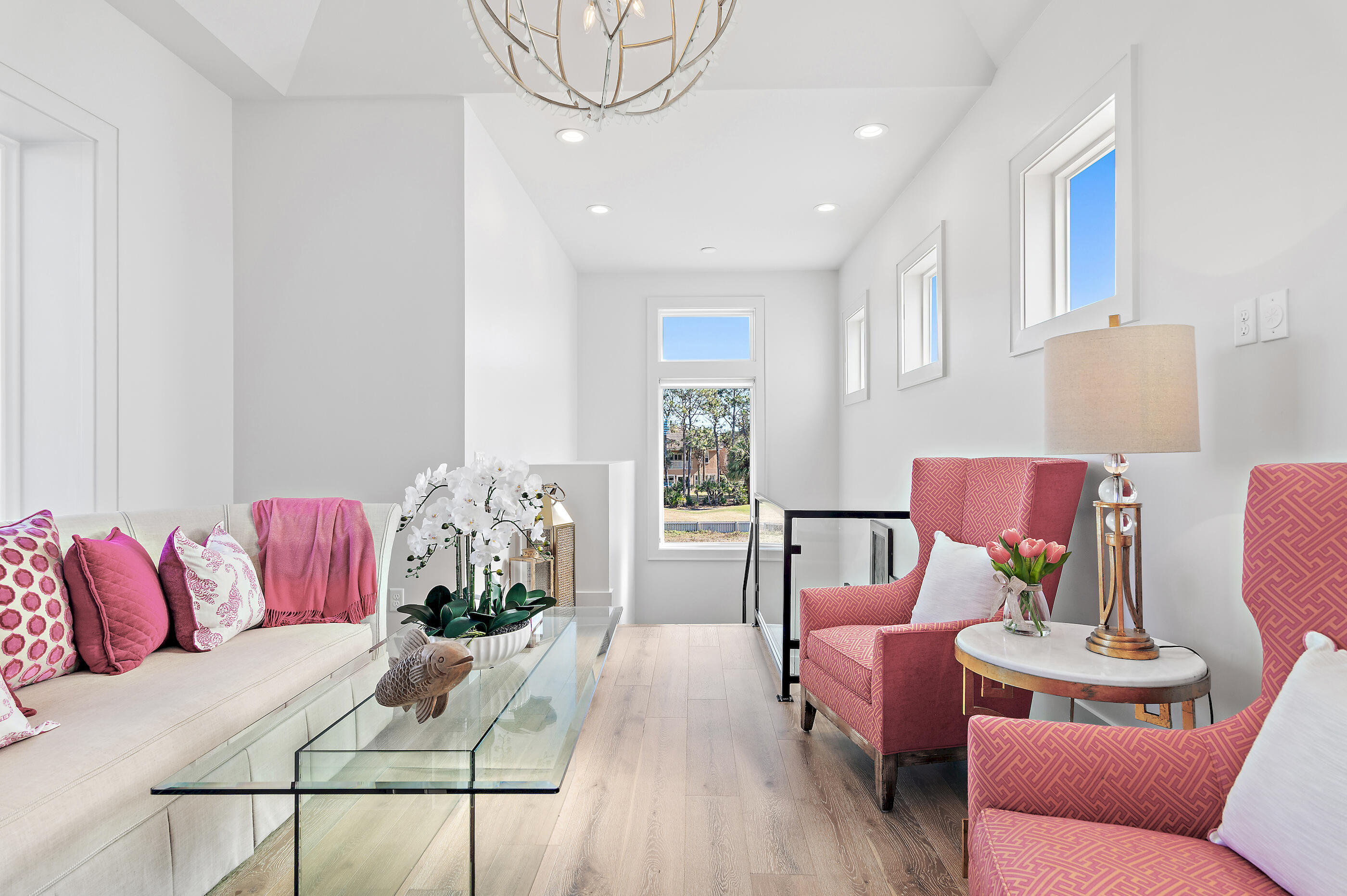 4572 Sailmaker Lane Destin, FL 32541 - Photo 36 of 49 a living room with furniture or couch and a potted plant