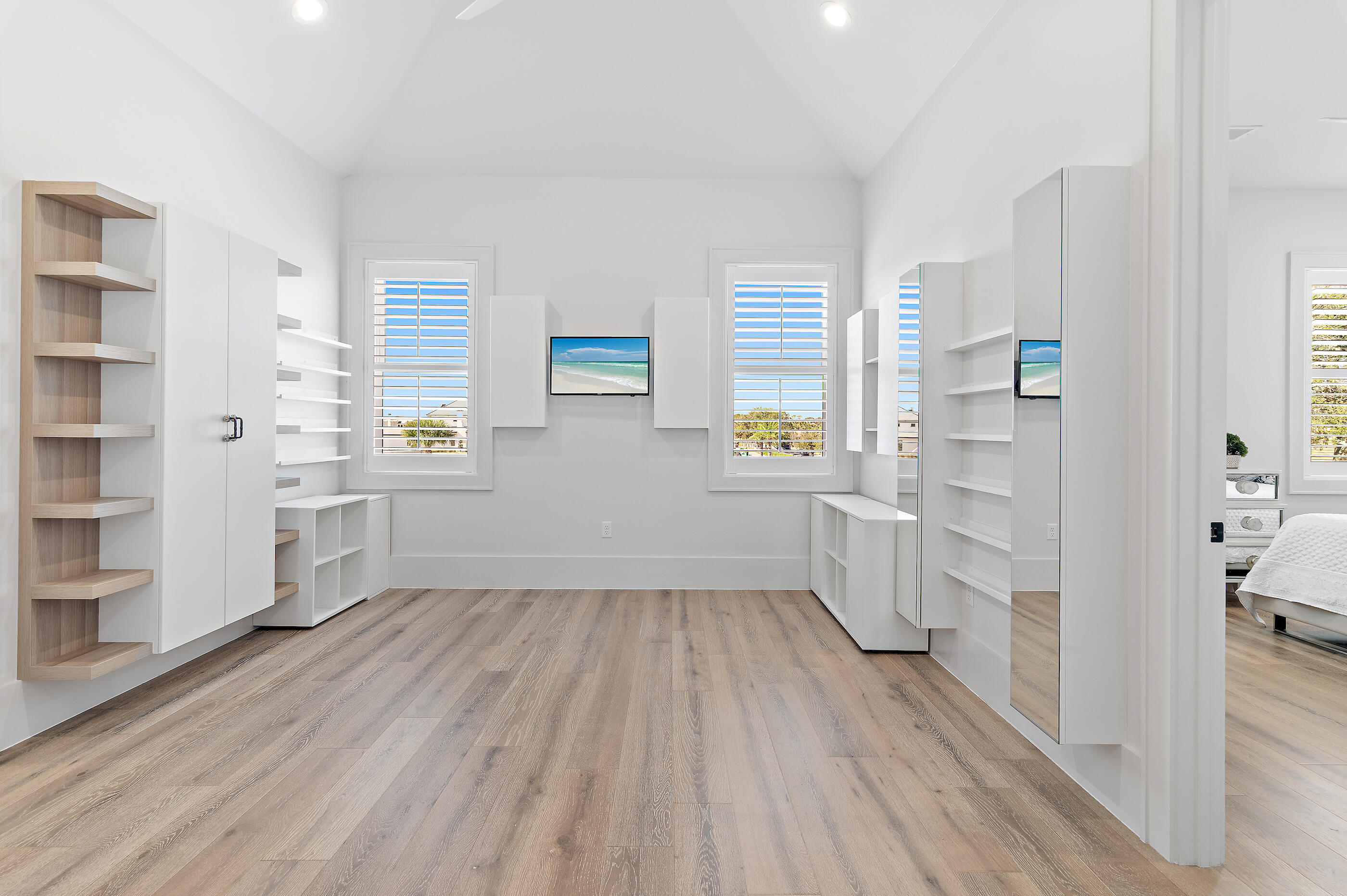 4572 Sailmaker Lane Destin, FL 32541 - Photo 40 of 49 a view of hallway with wooden floor and windows