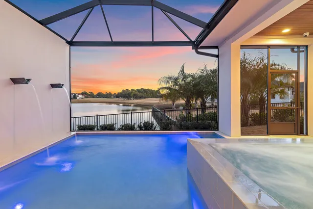 a view of swimming pool with a balcony