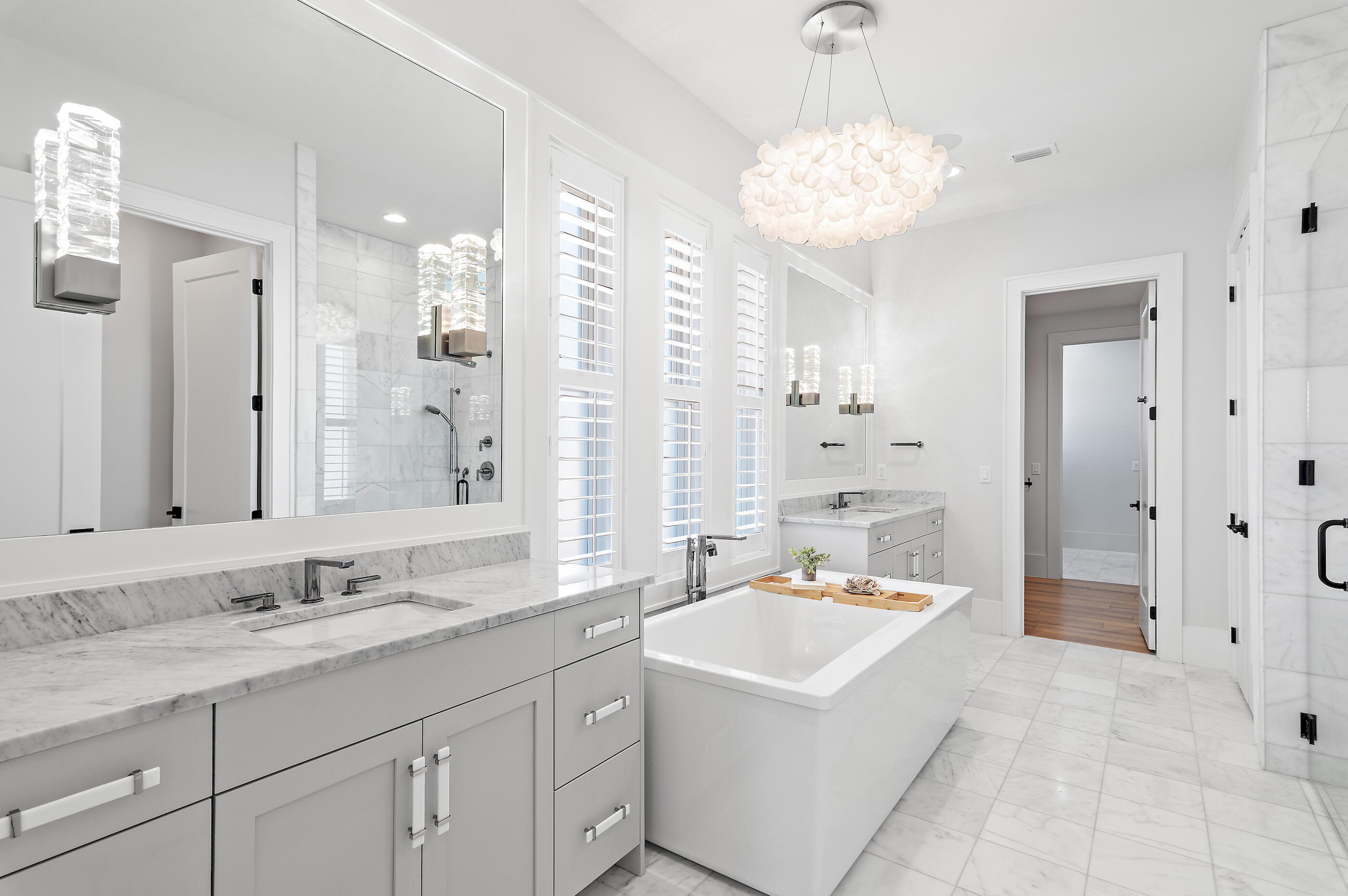 4572 Sailmaker Lane Destin, FL 32541 - Photo 6 of 49 a spacious bathroom with a sink double vanity and a mirror