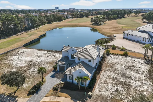 an aerial view of a house with outdoor space