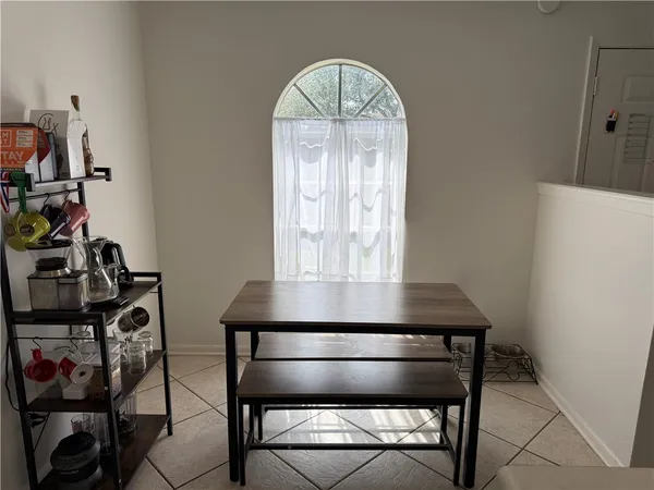 a view of a livingroom with furniture and a window