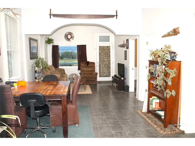 a view of a livingroom with furniture and window
