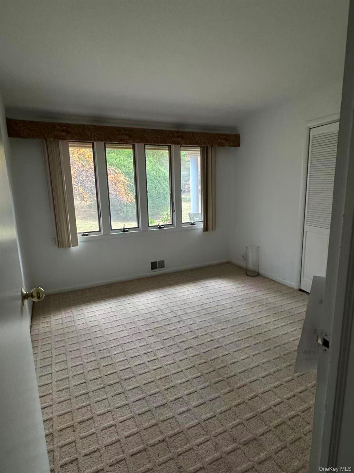 4 Norgate Road Glen Head, NY 11545 - Photo 12 of 25 a view of an empty room with a window