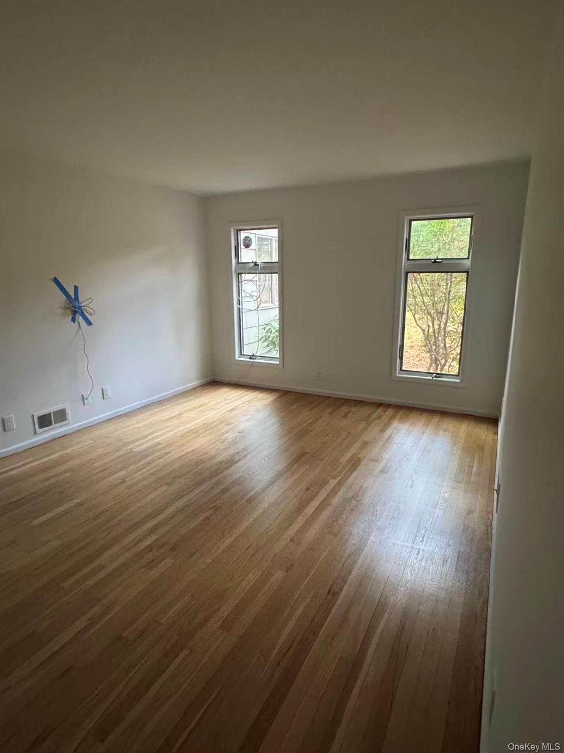 4 Norgate Road Glen Head, NY 11545 - Photo 13 of 25 a view of an empty room with wooden floor and a window
