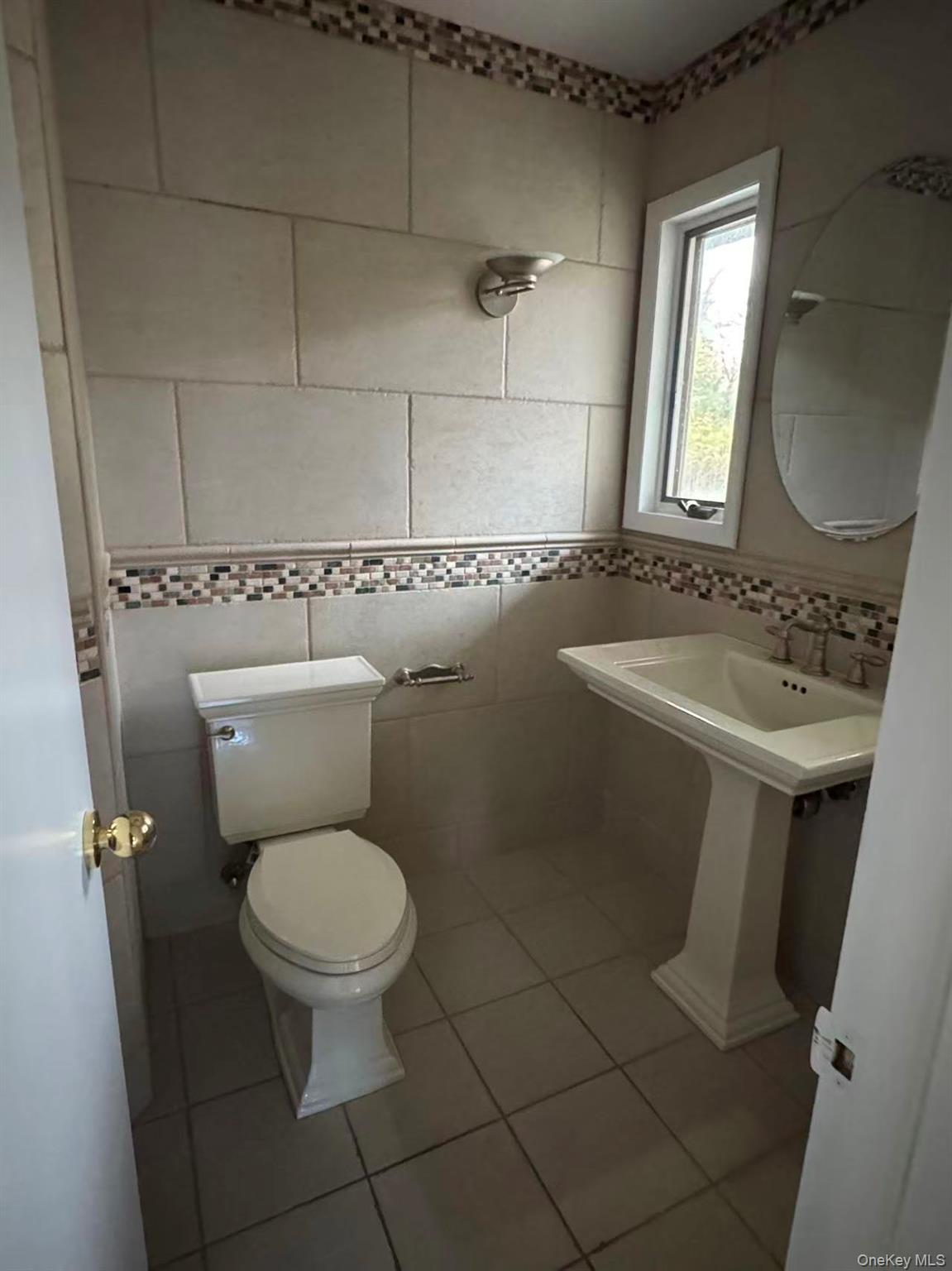 4 Norgate Road Glen Head, NY 11545 - Photo 14 of 25 a white toilet sitting next to a bathroom sink