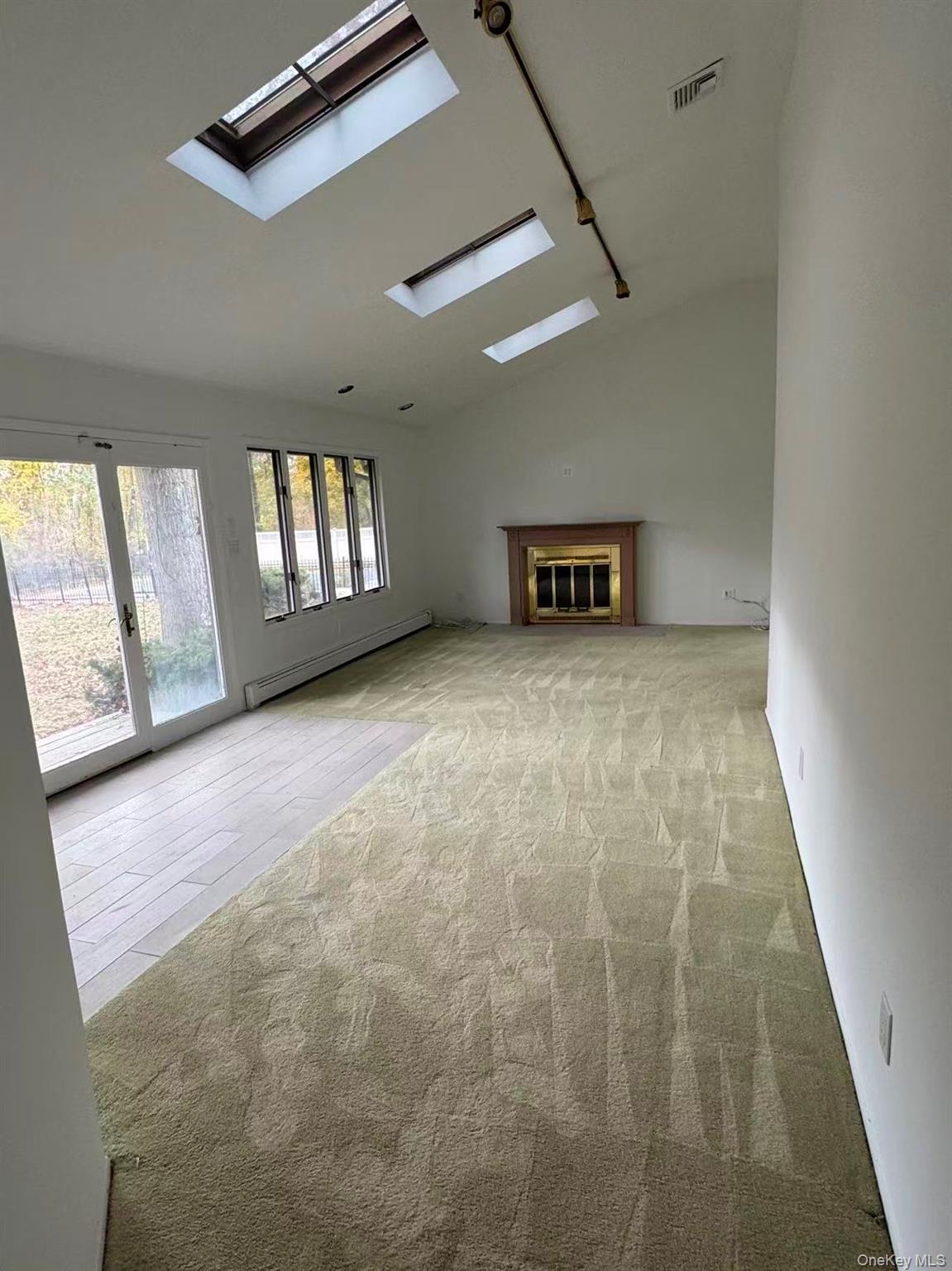 4 Norgate Road Glen Head, NY 11545 - Photo 15 of 25 a view of an empty room with a window and fireplace