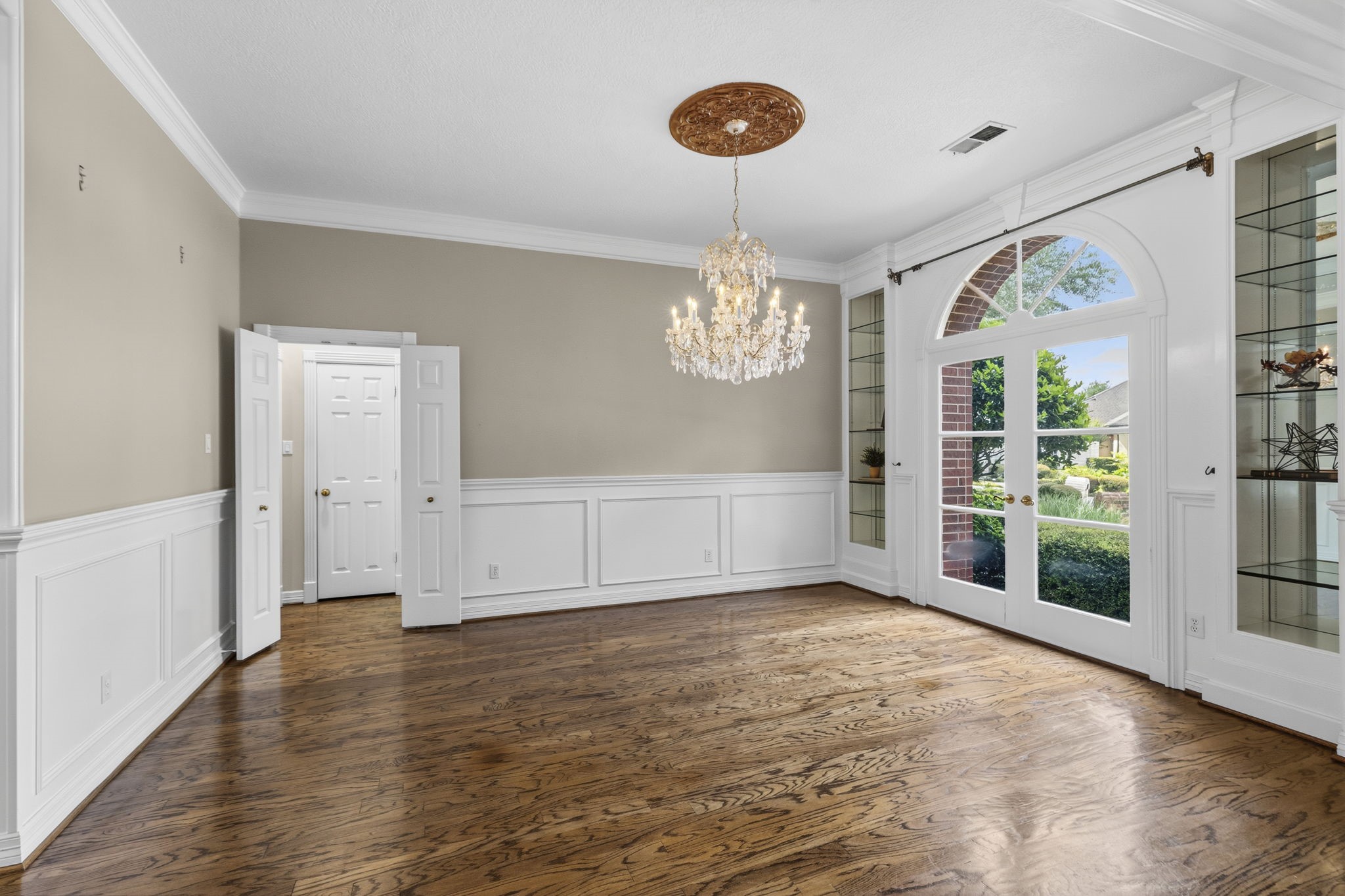 18310 Pamela Way Spring, TX 77379 - Photo 6 of 42 The formal dining room with glass bookshleves and double french doors